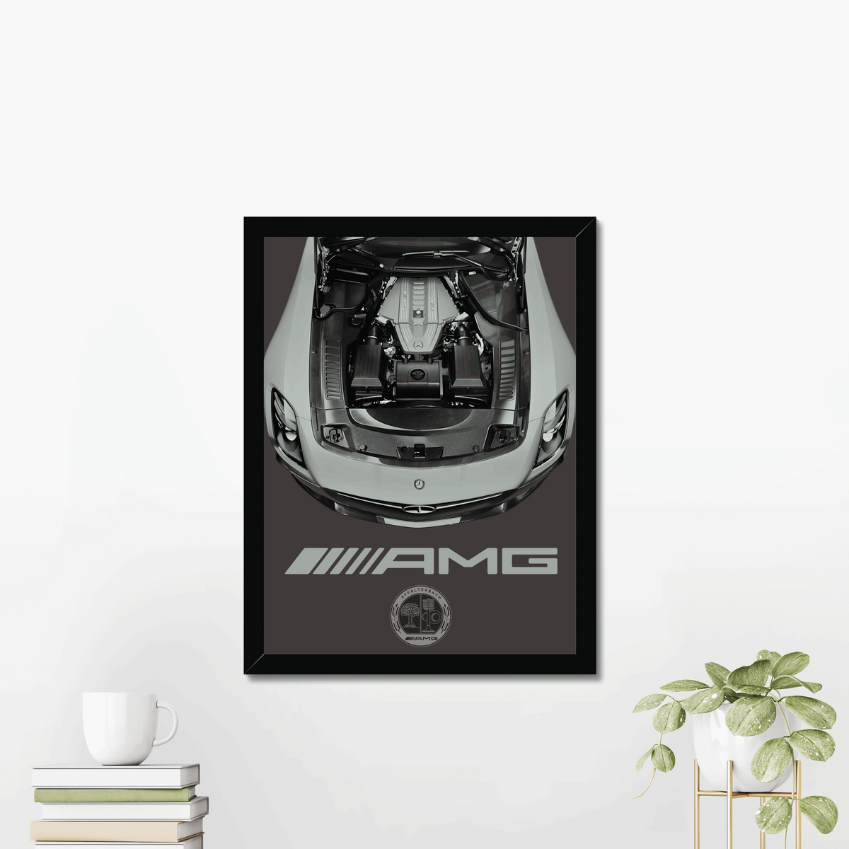 SLS engine-bay print displayed beside books and a plant