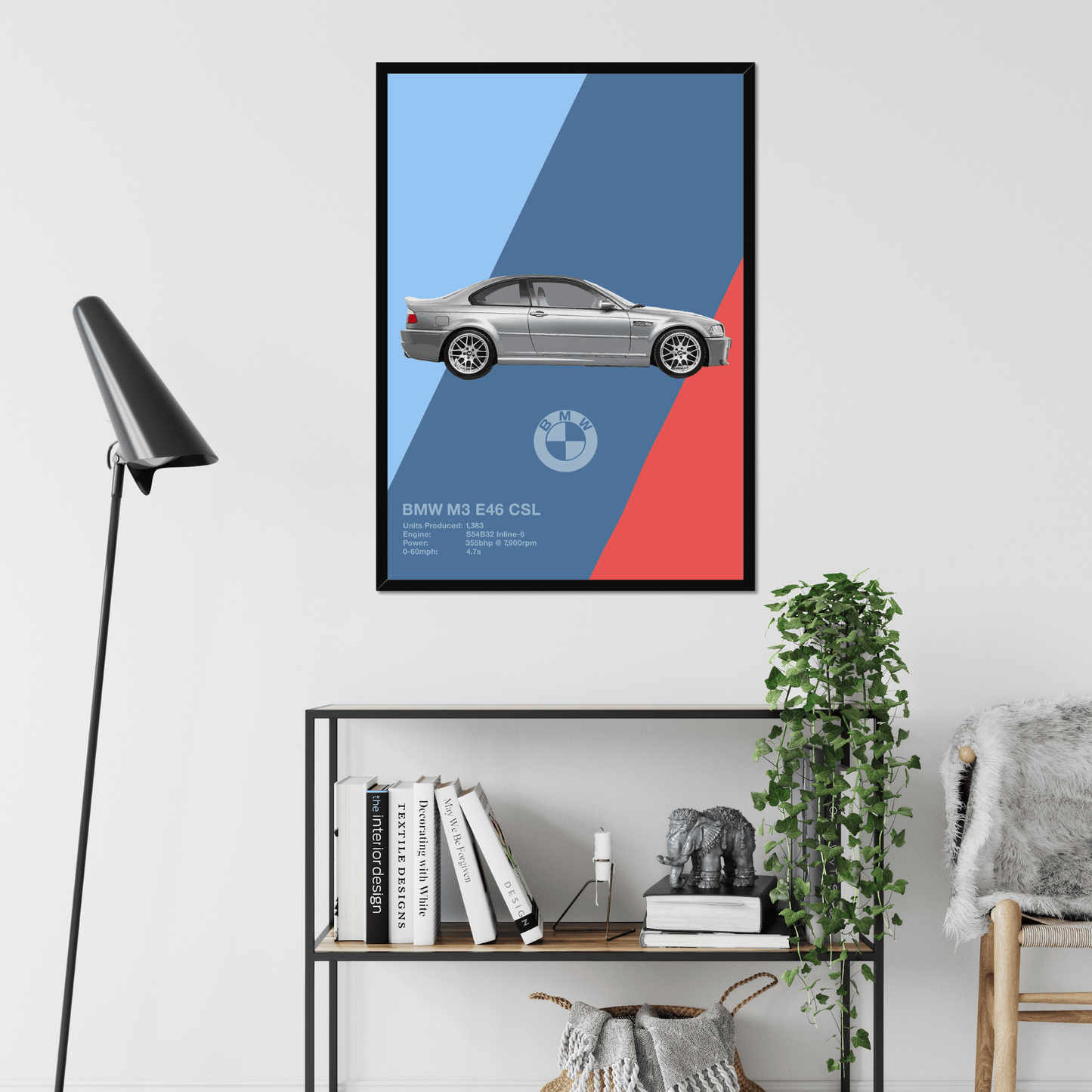 BMW M3 E46 CSL black-framed print above books and plants