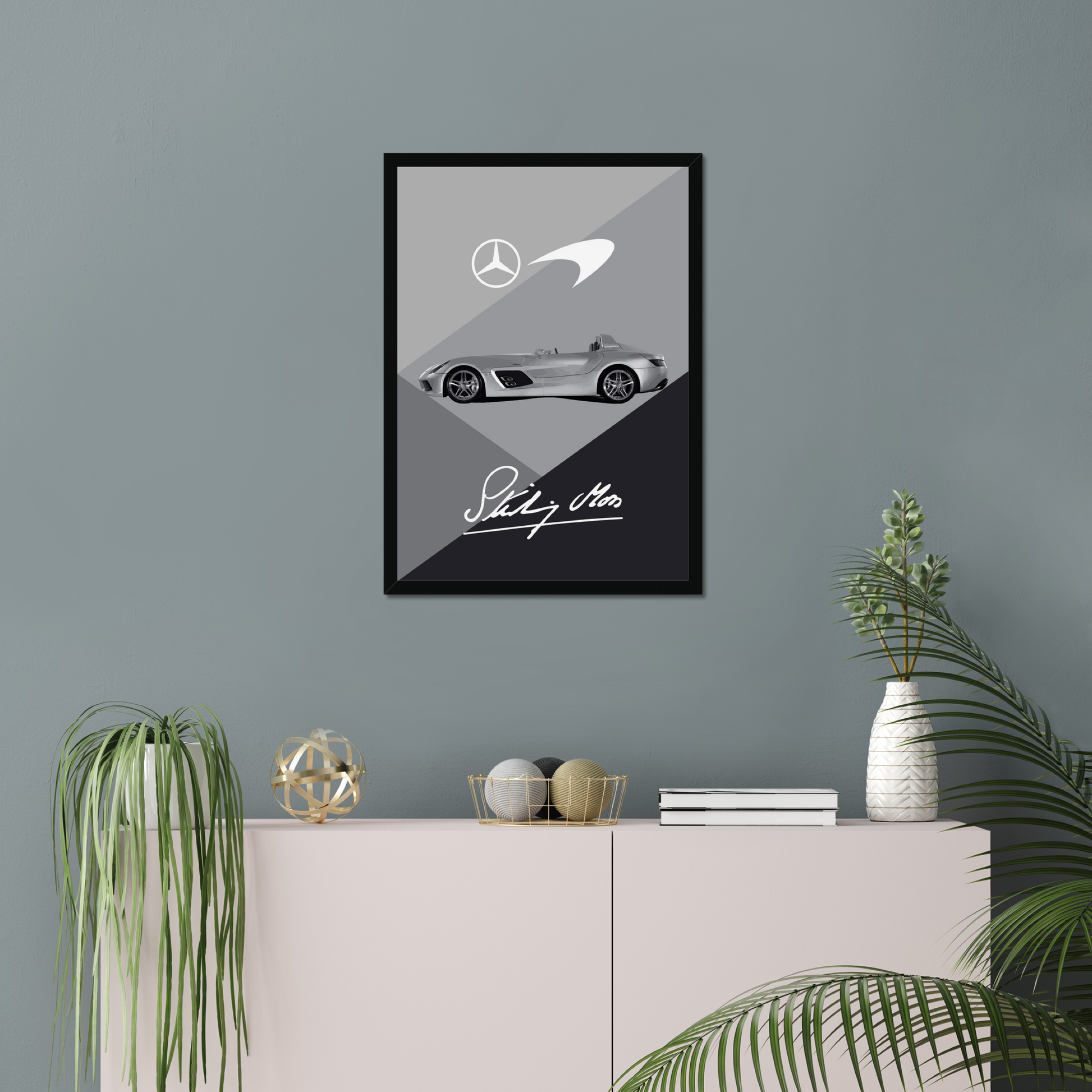 Black-framed Mercedes SLR McLaren artwork above a pale cabinet