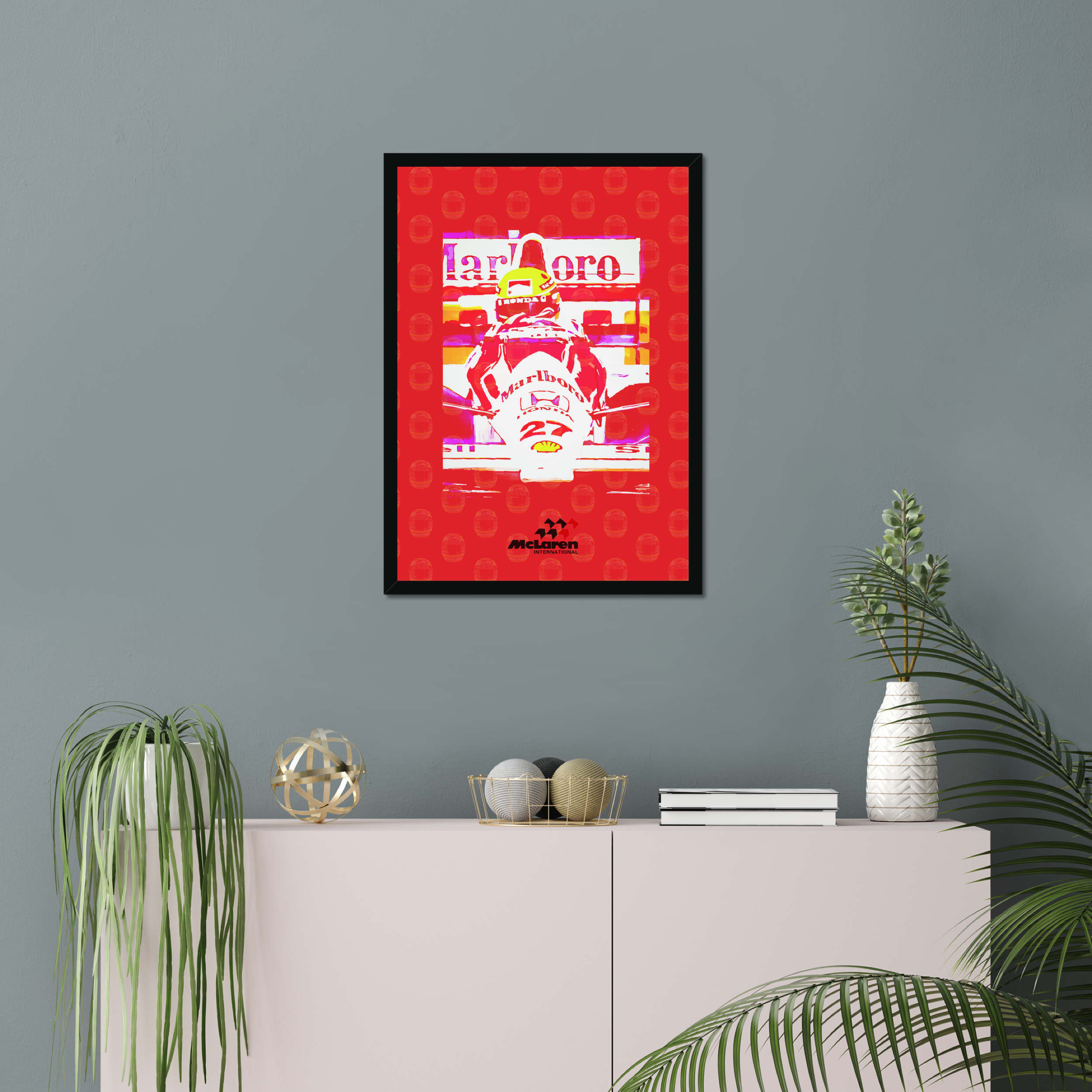 Ayrton Senna print displayed above plants and a console