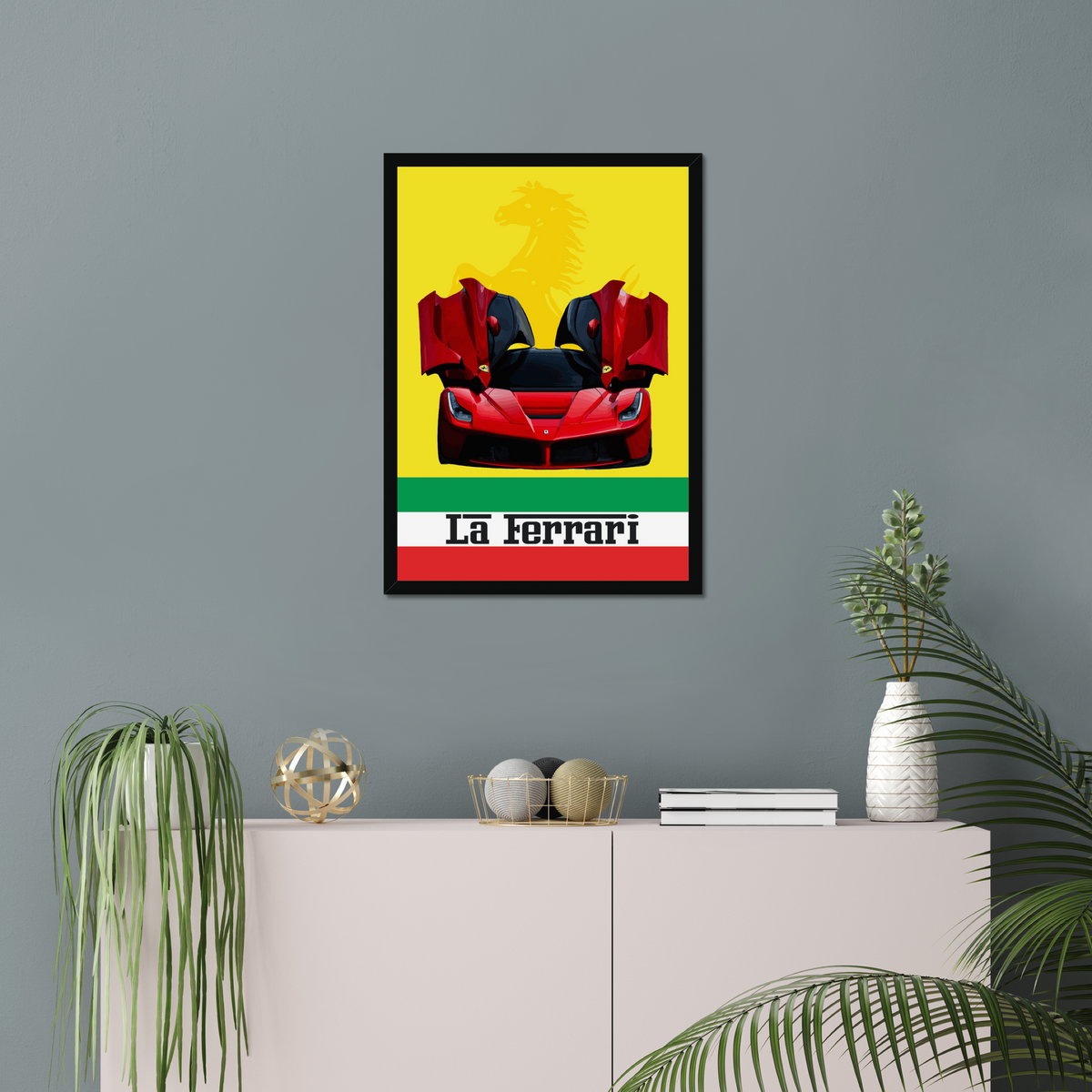 Black-framed LaFerrari artwork above a pale cabinet