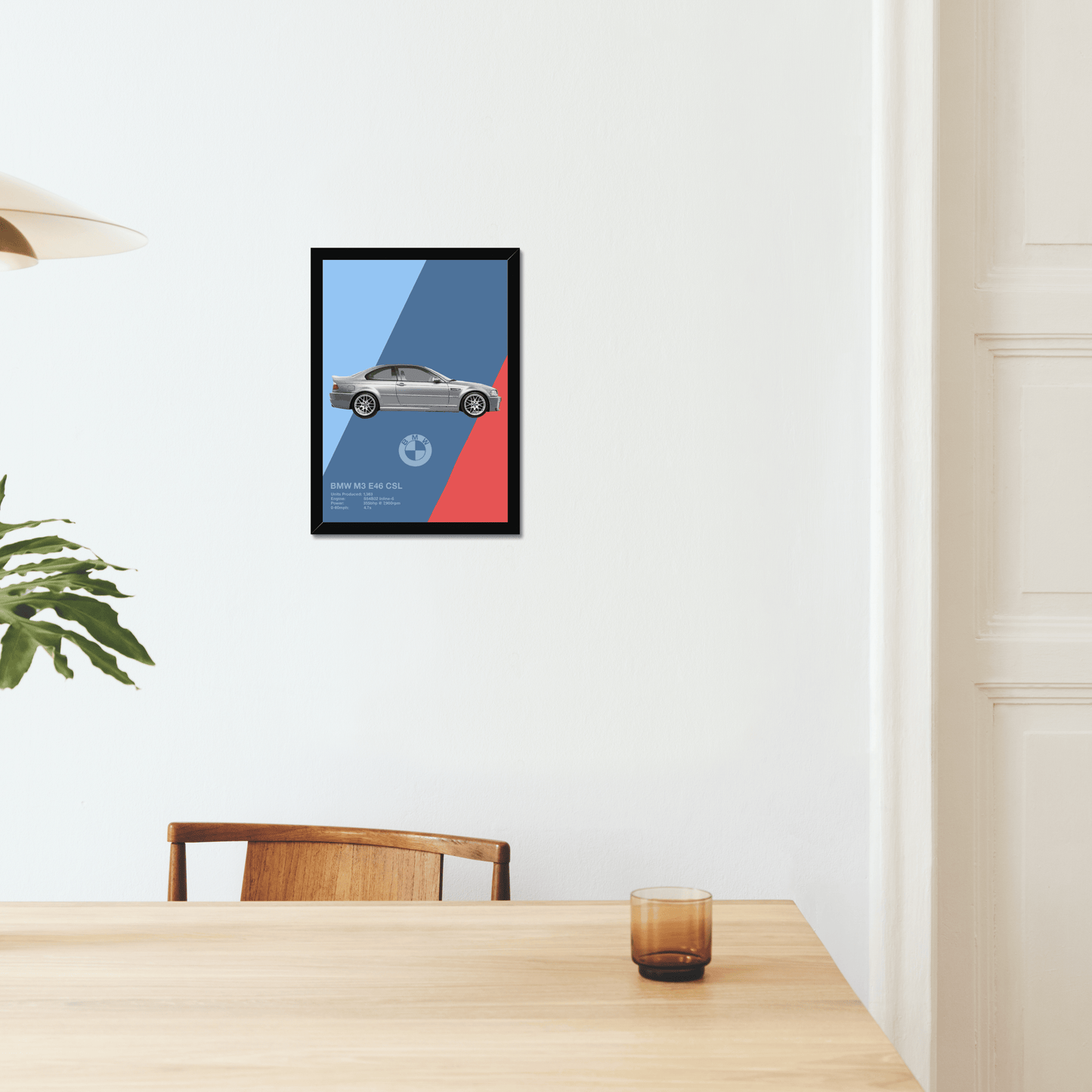 BMW M3 E46 CSL black-framed print above a dining table